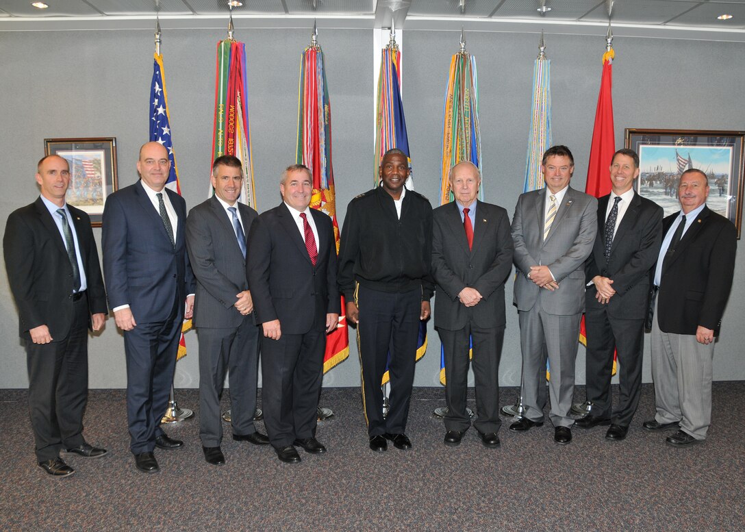 Leaders from private industry pose with DLA leaders, including Director Lt. Gen. Darrell Williams.