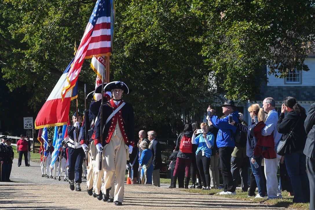 The 3rd Infantry Old Guard marches the flags to the Monument to Alliance and Victory during the Yorktown Day parade at Colonial National Historic Park, Virginia, Oct. 19, 2018.