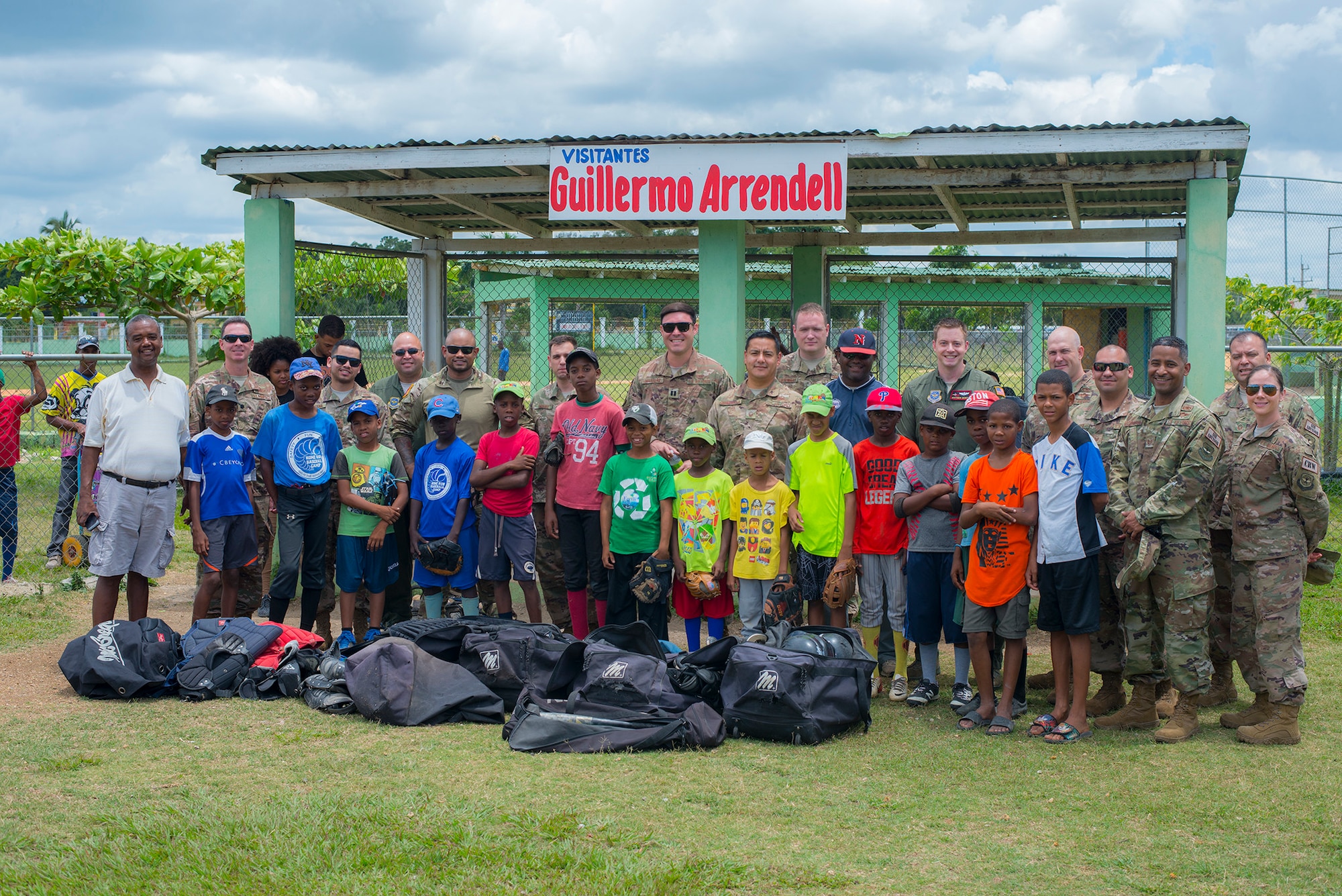 rmen from the 571st Mobility Support Advisory Squadron, donate baseball equipment to a local little league team in the town of Consuelo in the Dominican Republic. (Courtesy Photo)