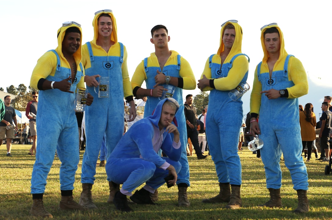 A team of Marines, aka “Minions,” participated in the stein race during the fifth annual Rocktoberfest at Marine Corps Air Station Cherry Point, N.C., Oct. 18, 2018. The goal of the stein race was to maneuver through an obstacle course with a stein full of water without spilling any; the group with the most maintained liquid, wins. Other events Rocktoberfest offered service members and their families included; a stein hoist, hammerschlagen, free food and drinks, and live music. (U.S. Marine Corps photo by Pfc. Jacob Bertram)
