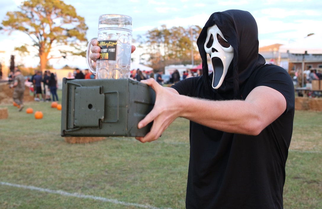 A participant balances a stein on an ammo can during a stein race at the fifth annual Rocktoberfest at Marine Corps Air Station Cherry Point, N.C., Oct. 18, 2018. The goal of the stein race was to maneuver through an obstacle course with a stein full of water without spilling any. Other events service members could participate in included; a stein hoist, hammerschlagen, free food and drinks, and live music. (U.S. Marine Corps photo by Pfc. Jacob Bertram)