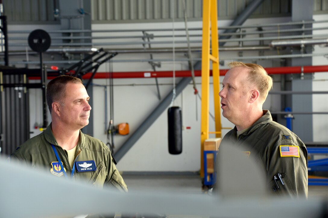 Col. Gregg Hesterman, the 178th Wing commander, discusses exercise operations with Col. Andrew Eiler, the 52nd Expeditionary Operations Group, Det. 2 Commander at Mirosławiec Air Base, Poland, Oct. 11, 2018. The 178th Wing joined service members from nine different countries to participate in Clear Sky 2018.