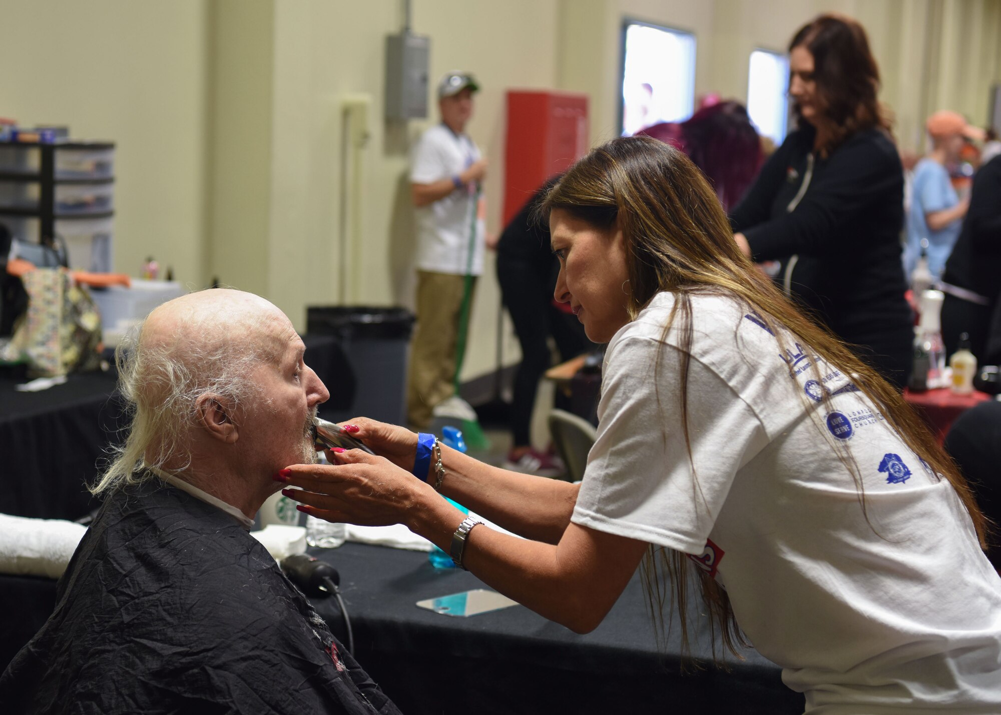 A local veteran receives a haircut and trim by a Veteran Stand Down volunteer Oct. 20, 2018 at the Santa Maria Fair Grounds, Calif. Over 180 services were offered for the veterans in need in the local community.