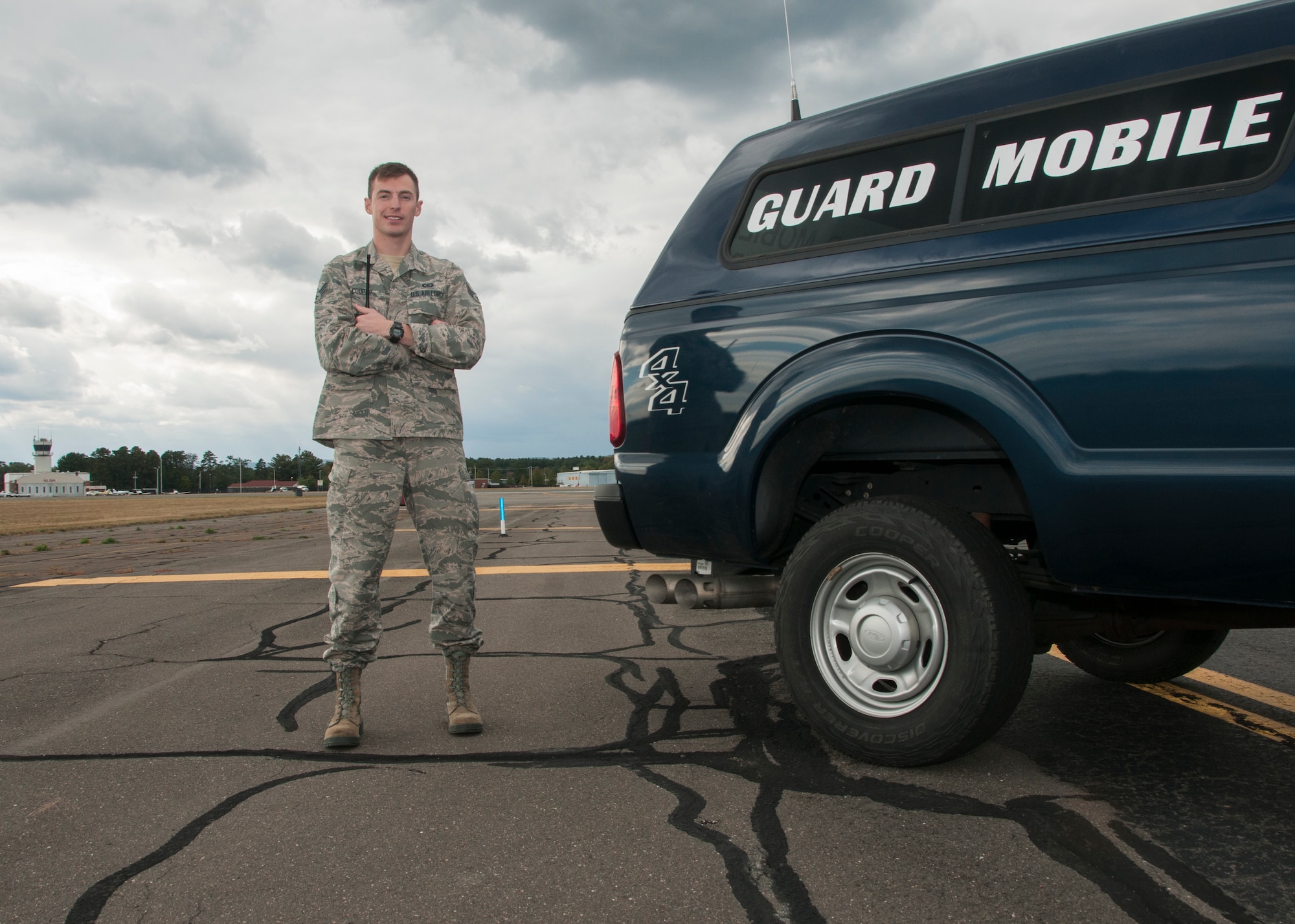 Senior Airman Calvin Cooper, 104th Operations Group airfield management shift leader, poses for a photo on the flight line Oct. 17, 2018, at Barnes Air National Guard Base, Massachusetts. Cooper was recently selected to become a pilot at the 104th Fighter Wing. (U.S. Air National Guard Photo by Airman 1st Class Randy Burlingame)