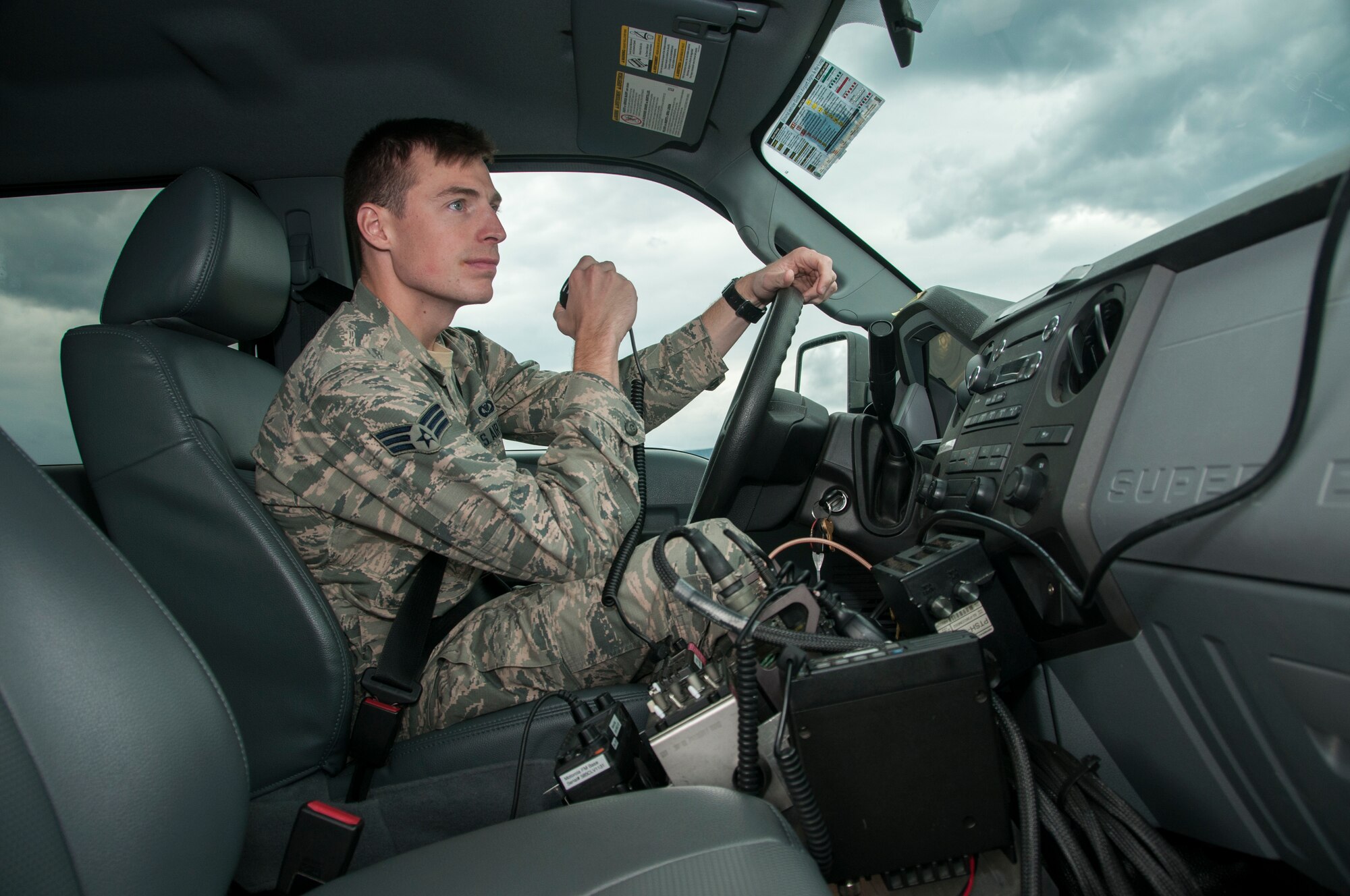 Senior Airman Calvin Cooper, 104th Operations Group airfield management shift leader, poses for a photo on the flight line Oct. 17, 2018, at Barnes Air National Guard Base, Massachusetts. Cooper was recently selected to become a pilot at the 104th Fighter Wing. (U.S. Air National Guard Photo by Airman 1st Class Randy Burlingame)