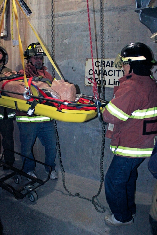 First responders from local fire departments, alongside U.S. Army Corps of Engineers, Baltimore District team members, practice an emergency basket lift and chain fall in preparation for assisting injured personnel during a training exercise at East Sidney Lake Dam in Delaware County, New York, Oct. 13, 2018. More than 25 members of the Wells Bridge, Otego and Unadilla fire departments practiced safety procedures and rescue operations in confined spaces during the training simulation. (U.S. Army photo by Brianna K. Dandridge)