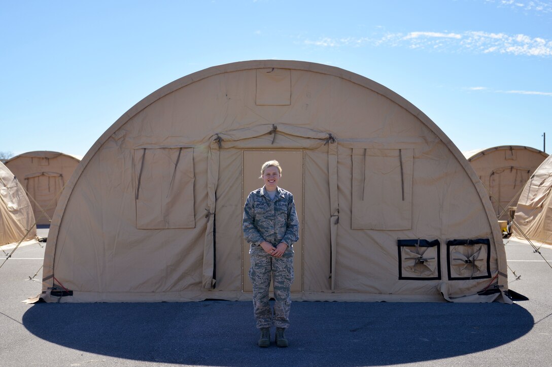 Photo Cutline: Airman 1st Class Carli Johnson, 325th Force Support Squadron food services journeyman, smiles for a photo at Tyndall Air Force Base, Fla., Oct. 21, 2018. Johnson’s house sustained severe damage during Hurricane Michael. She is currently providing assistance in the Team Tyndall recovery efforts as they work to bring base operations back to normal. (U.S. Air Force photo by Staff Sgt. Jeffrey Schultze)