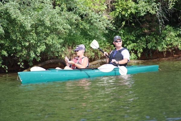 Mike Brown, senior geotechnical engineer with the U.S. Army Corps of Engineers Nashville District, and (name) canoe the Cumberland River in Carthage, Tenn., June 23, 2018 on Leg 28 of a 650.4-mile journey of the Cumberland River. The objective of navigating the waterway was to celebrate the 130th Anniversary of the U.S. Army Corps of Engineers Nashville District, reflect on the development of the Cumberland River Basin, remember the past, enjoy the present, and dream about the future of the waterway that is vitally important to the region. (USACE Photo)