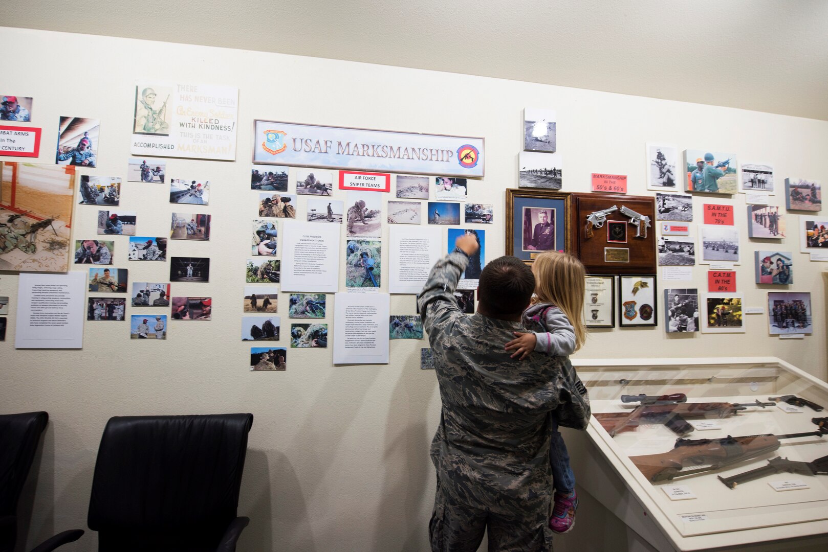 Air Force Master Sgt. Justin Bosh, 72nd Security Forces Squadron, Tinker Air Force Base, Okla., explains part of an exhibit to his daughter at the Security Forces Museum Foundation at Joint Base San Antonio-Lackland, Texas, Oct. 19, 2018. The artifacts on display have come from multiple sources to include former Airmen and other museums that have closed, as well as the National Museum of the U.S. Air Force at Wright-Patterson Air Force Base, Ohio.