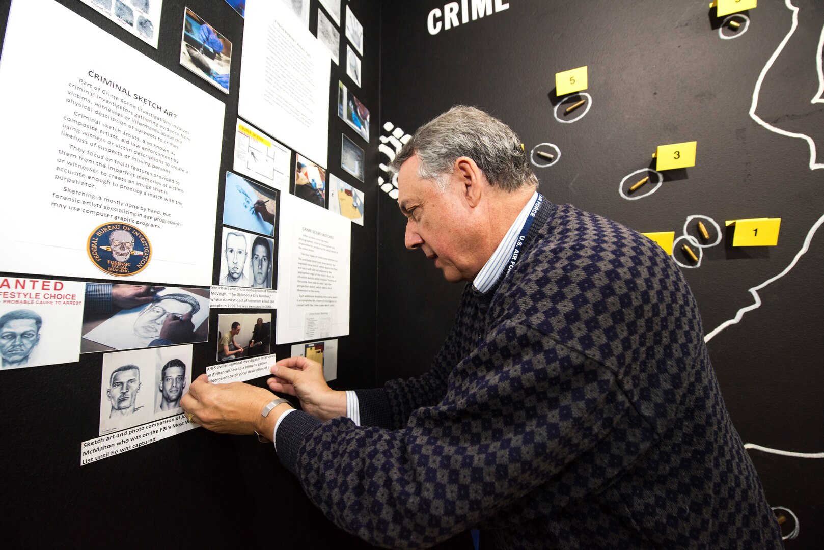 Rudy Purificato, Airman Heritage Museum director, works on a new crime scene exhibit in the Security Forces Museum at Joint Base San Antonio-Lackland, Texas, Oct. 19, 2018. The Air Education and Training Command history office owns and is responsible for the Enlisted Heritage and Training Complex and they are committed to ensuring it will continue to grow and evolve into a world-class training environment for current and future Airmen.