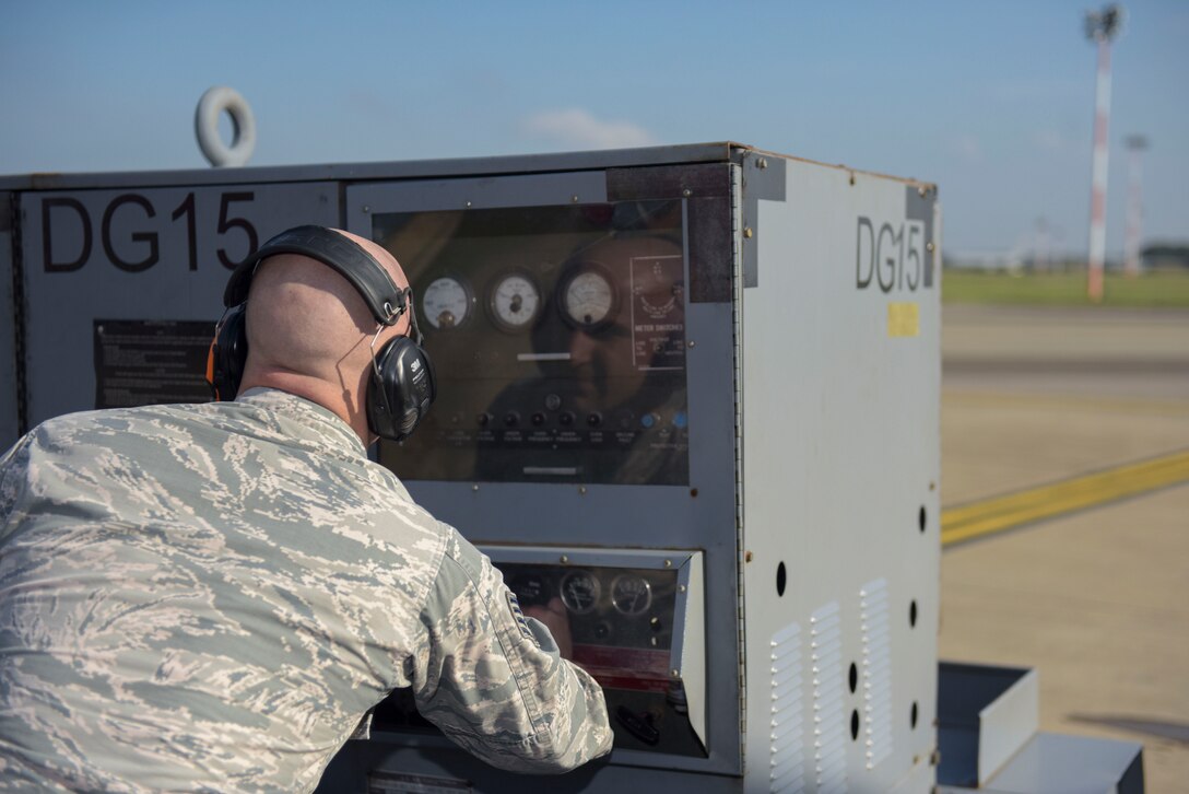 U.S. Air Force Staff Sgt. Randy Duncan, 95th Reconnaissance Squadron RC-135 electronic warfare craftsman, starts a generator for a RC-135 Rivet Joint at RAF Mildenhall, England, Oct. 16, 2018.