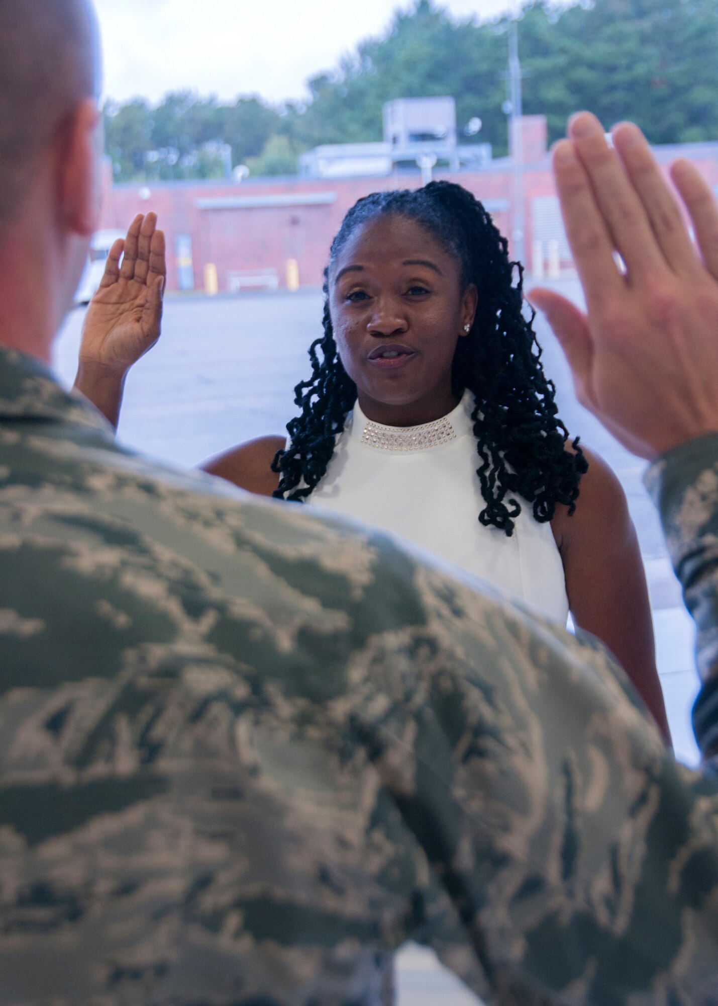 Tysha M. Wiggins, Chimia Coleman and London Lindo pose for a picture after Wiggins enlisted into the 104th Maintenance Group as a crew chief Oct. 11, 2018, at Barnes Air National Guard Base, Massachusetts. Wiggins and her family chose to join the 104th Fighter Wing because of the family orientated environment. (U.S. Air National Guard Photo by Airman 1st Class Randy Burlingame)