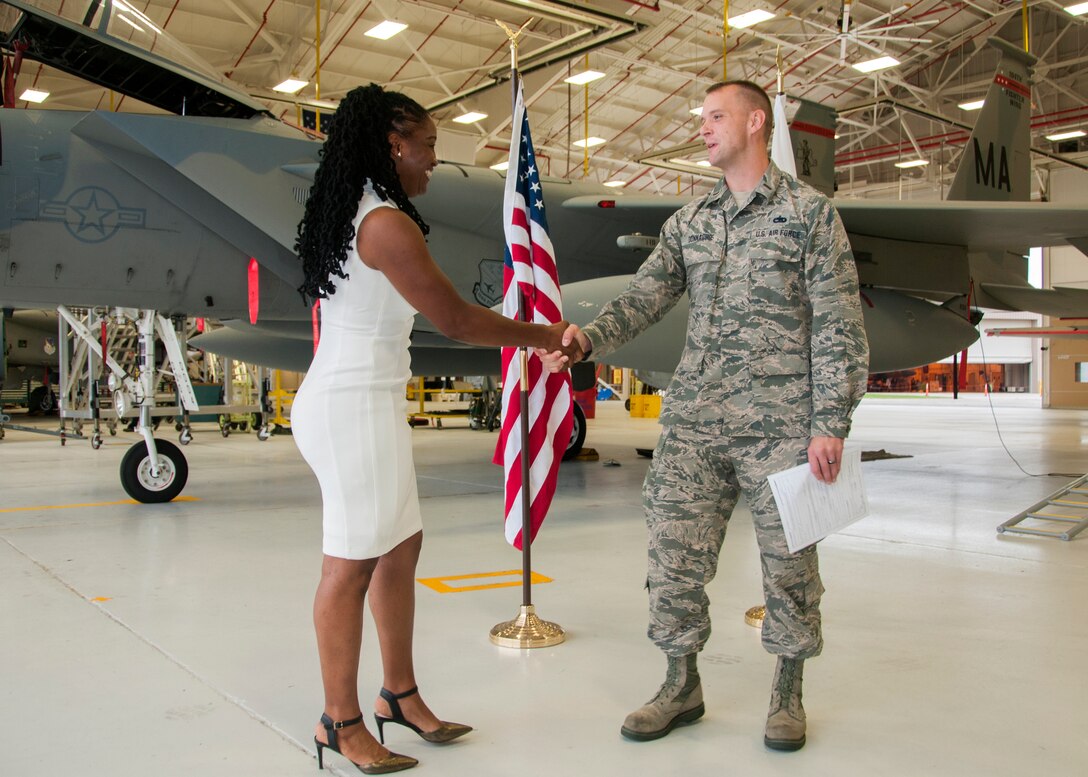 Tysha M. Wiggins, Chimia Coleman and London Lindo pose for a picture after Wiggins enlisted into the 104th Maintenance Group as a crew chief Oct. 11, 2018, at Barnes Air National Guard Base, Massachusetts. Wiggins and her family chose to join the 104th Fighter Wing because of the family orientated environment. (U.S. Air National Guard Photo by Airman 1st Class Randy Burlingame)