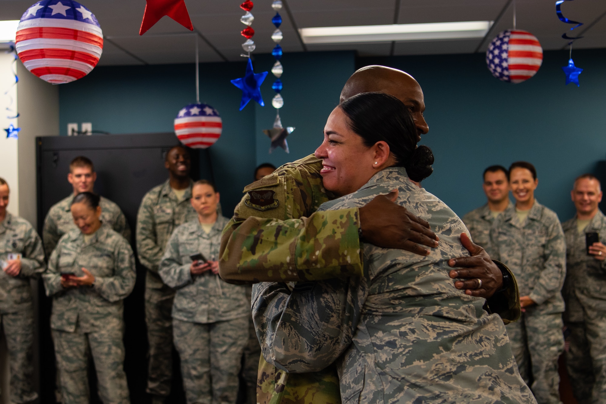 Chief Master Sgt. of the Air Force Kaleth O. Wright hugs an Airman during a meet and greet in the 56th Medical Group, Oct. 22, 2018 at Luke Air Force Base, Ariz.