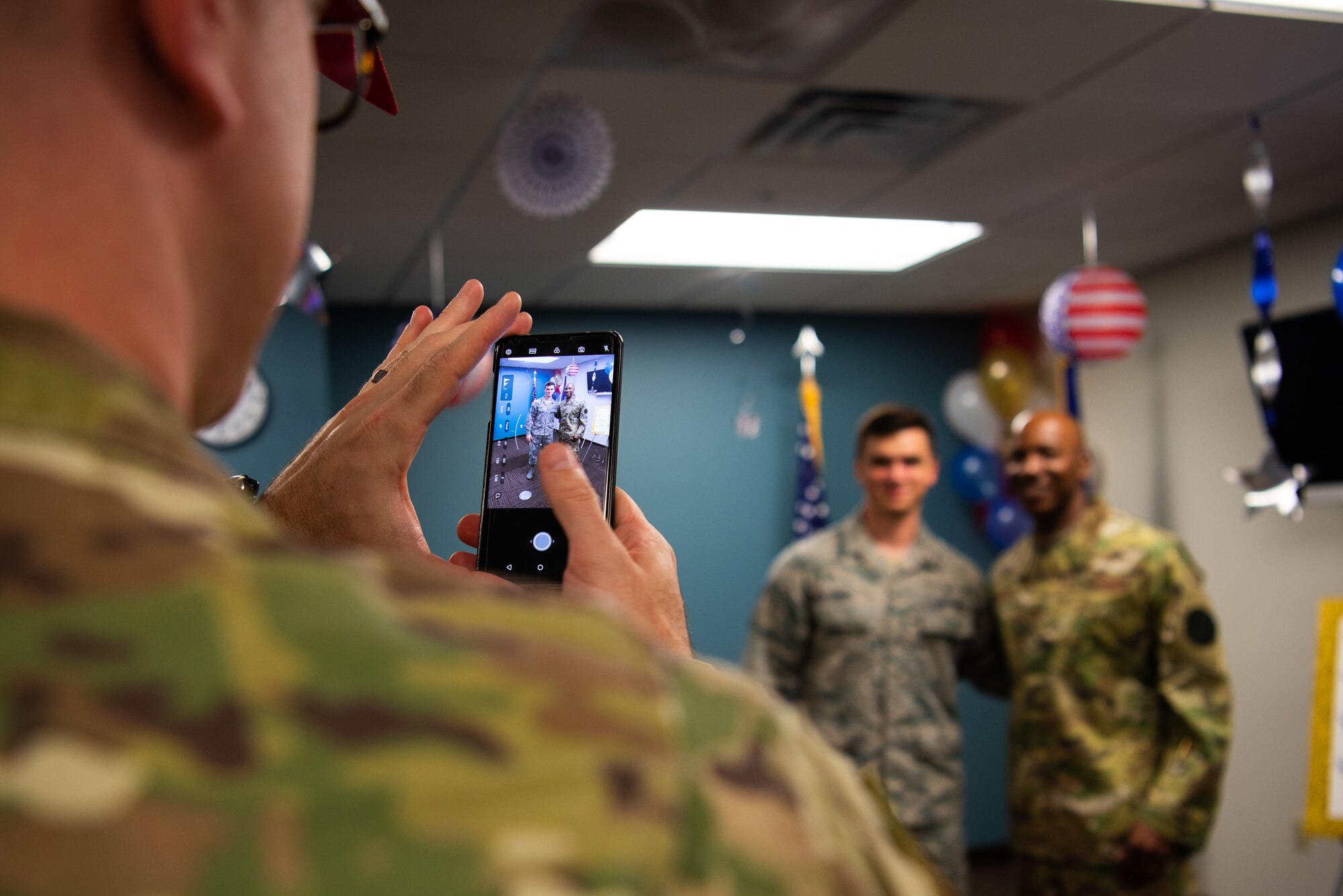 Chief Master Sgt. of the Air Force Kaleth O. Wright poses with an Airman for a photo during a meet and greet in the 56th Medical Group, Oct. 22, 2018 at Luke Air Force Base, Ariz.