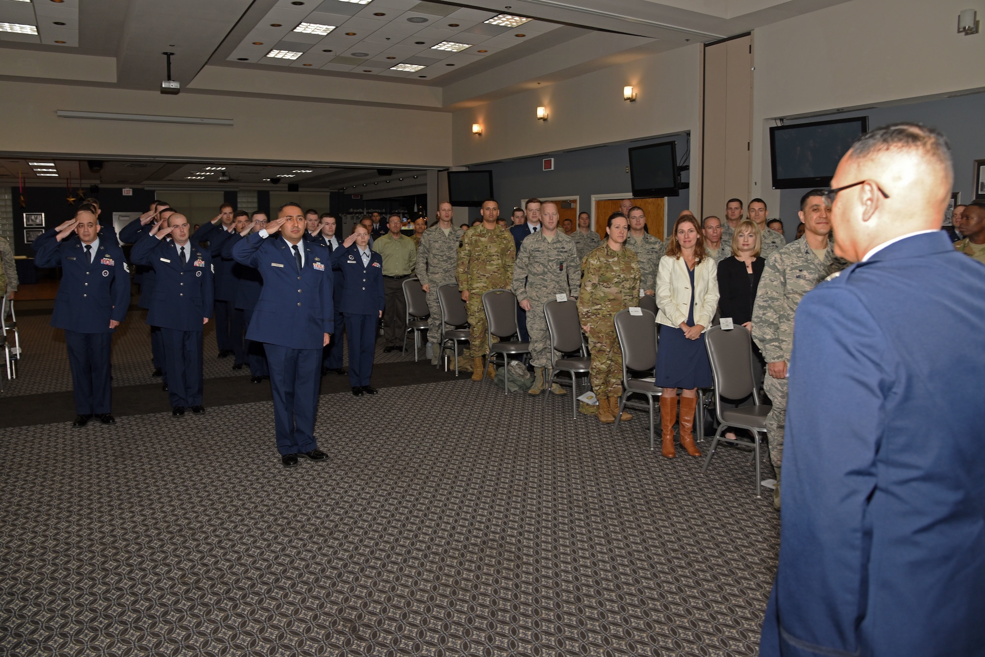 U.S. Air Force Lt. Col. David Sarabia, 313th Training Squadron commander, salutes his squadron for the first time during the 313th TRS Assumption of Command at the Event Center on Goodfellow Air Force Base, Texas, Oct. 24, 2018. The assumption of command ceremony provides an opportunity for members of the unit to see their new commander, and for the new commander to inspect his or her troops. (U.S. Air Force photo by Staff Sgt. Joshua Edwards/Released)