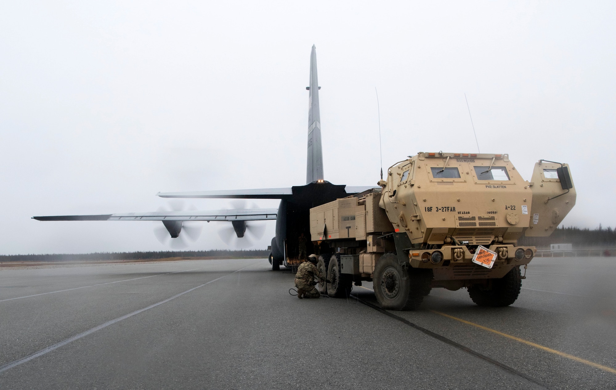 U.S. Army Pfc. Mary Slatten, a High Mobility Artillery Rocket System (HIMARS) driver, assigned to Alpha Battery, 3rd Battalion, 27th Field Artillery Regiment (HIMARS), 18th Field Artillery Brigade, Fort Bragg, N.C., inflates the tires of a M142 HIMARS at Fort Greely, Alaska, Oct. 19, 2018, during Red Flag-Alaska 19-1. Slatten’s unit was tasked to provide long-range artillery support during RF-A, allowing the unit to showcase its capabilities and develop relationships with other services. As part of transporting the M142 HIMARS, it’s required to deflate the tires and lower the suspension in order to load it into a U.S. Air Force C-130J Super Hercules.