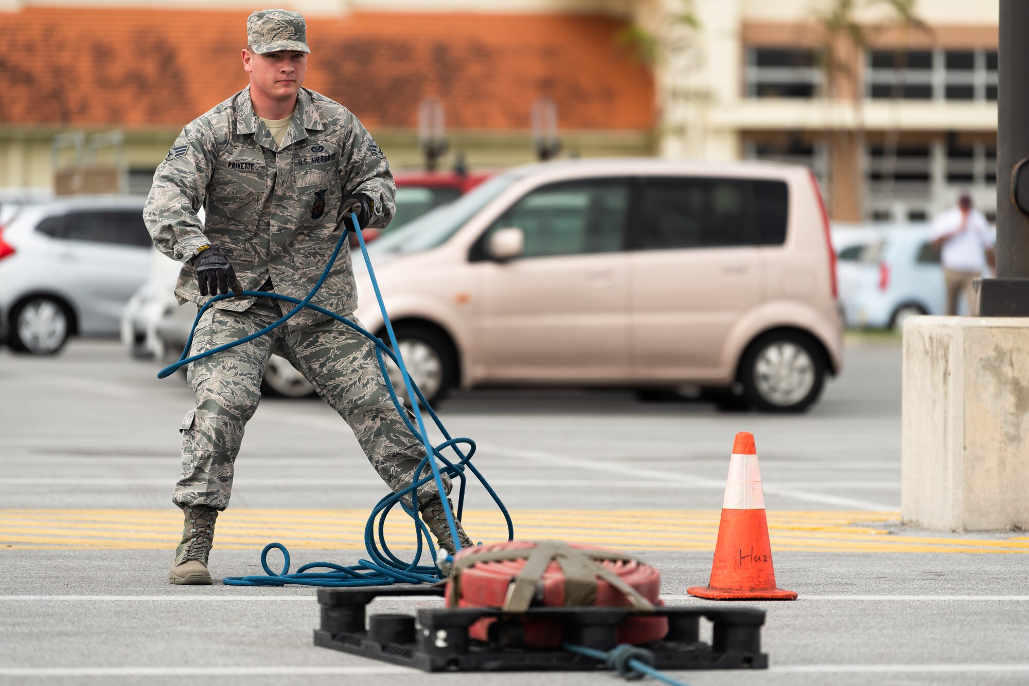 U.S. Air Force Senior Airman Forrest Privette, 18th Civil Engineer Squadron firefighter, pulls a sled during the 2018 Fire Muster Oct. 11, 2018, at Kadena Air Base, Japan.  A fire muster gives people a chance to experience tasks a firefighter would during an emergency. (U.S. Air Force photo by Airman 1st Class Matthew Seefeldt)
