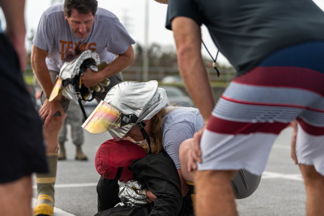 A participant drags a dummy during the 2018 Fire Muster Oct. 11, 2018, at Kadena Air Base, Japan.  The fire muster was one of many events hosted by the 18th Civil Engineer Squadron during Fire Prevention Week. (U.S. Air Force photo by Airman 1st Class Matthew Seefeldt)