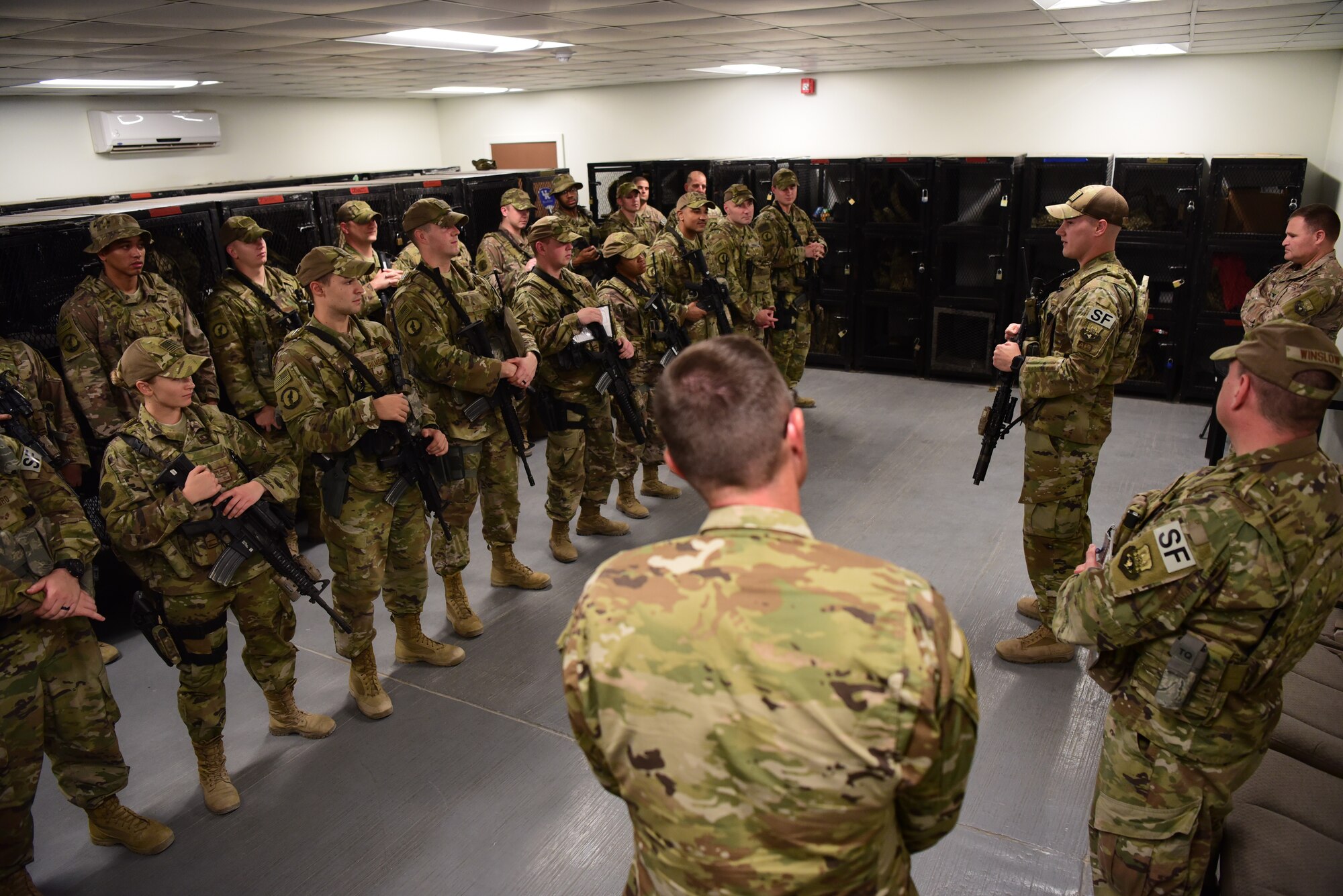 Staff Sgt. Justin Van Niman, 387th Expeditionary Security Forces Squadron fire team member, provides a brief prior to guard mount Oct. 16, 2018, at an undisclosed location in Southwest Asia. Van Niman is the latest Rock Solid Warrior. The Rock Solid Warrior program is a way to recognize and spotlight the Airmen of the 386th Air Expeditionary Wing for their positive impact and commitment to the mission.(U.S. Air Force photo by Staff Sgt. Christopher Stoltz)