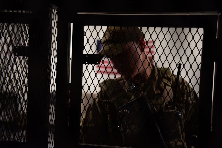 Staff Sgt. Justin Van Niman, 387th Expeditionary Security Forces Squadron fire team member, places a bag into a locker Oct. 16, 2018, at an undisclosed location in Southwest Asia. As a security forces member, Van Niman keeps personnel and assets here safe. (U.S. Air Force photo by Staff Sgt. Christopher Stoltz)