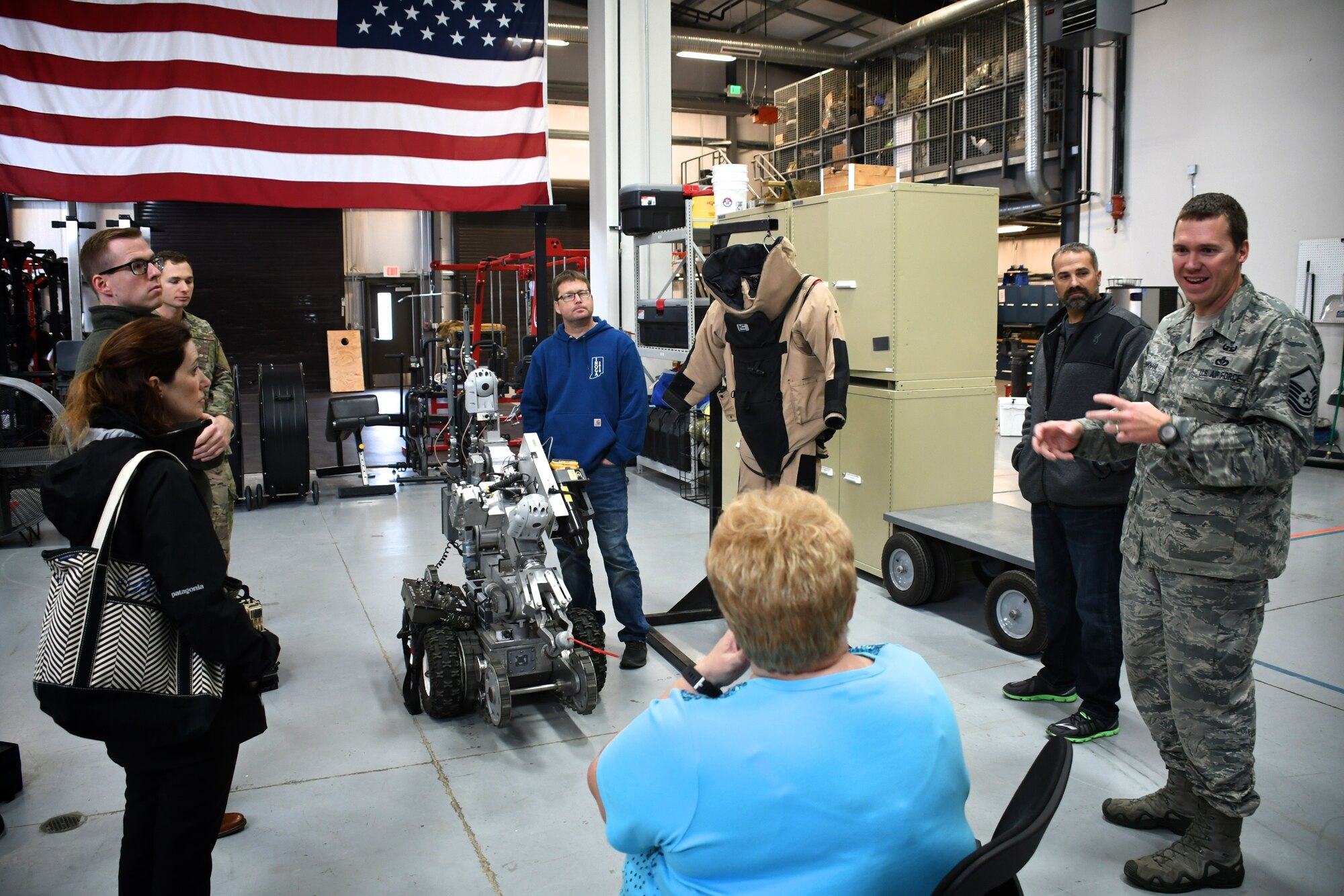 Master Sgt. David Pinkham answers questions about the training requirements of explosive ordnance disposal (EOD) specialists and various tools they use, like the remote-controlled robot at center.  The visit took place during the annual Boss Day tour at the 932nd Airlift Wing, October 13, 2018 at Scott Air Force Base, Ill. Pinkham is an explosive ordnance disposal (EOD) specialist assigned to the 932nd Civil Engineer Squadron. Boss Day helps civilian employers better understand the Air Force Reserve mission and strengthens the employer-reservist relationship. The 932nd AW is made up of four core groups including the 932nd Maintenance Group, Medical Group, Mission Support Group, and Operations Group.  The Illinois unit is the only Air Force Reserve Command wing, attached to 22nd Air Force, that flies the C-40C. 
(U.S. Air Force photo by Lt. Col. Stan Paregien)