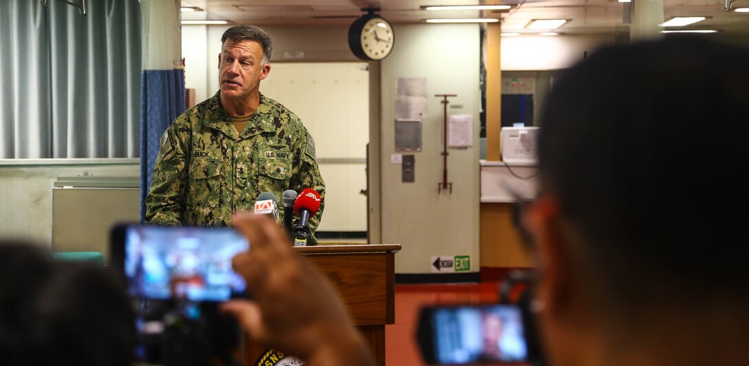 Rear Adm. Sean S. Buck, commander, U.S. 4th Fleet, delivers remarks at a press conference aboard the hospital ship USNS Comfort in Ecuador.