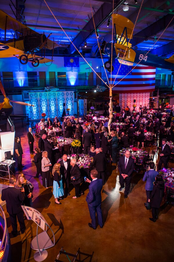 Guests socialize with each other and honor Col. Walter Cunningham, United States Marine Corps retired fighter pilot and Apollo 7 lunar module pilot, during the 50th Anniversary of the Apollo 7 mission at the Frontiers of Flight Museum in Dallas, Oct. 20, 2018. Apollo 7 was the only manned Apollo mission launched on a Saturn 1-B rocket and from pad 34 at Cape Kennedy. It was the first manned test of the Command and Service Module. The crew orbited the Earth 163 times and spent 10 days and 20 hours in space. It also featured the first live TV from a manned spacecraft. (U.S. Marine Corps photo by Lance Cpl. Melany Vasquez/Released)