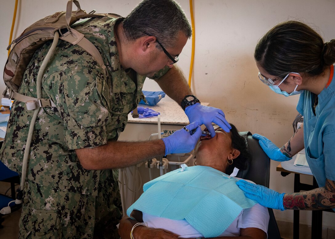U.S. Navy dental personnel numb a patient before performing a dental procedure in Ecuador.
