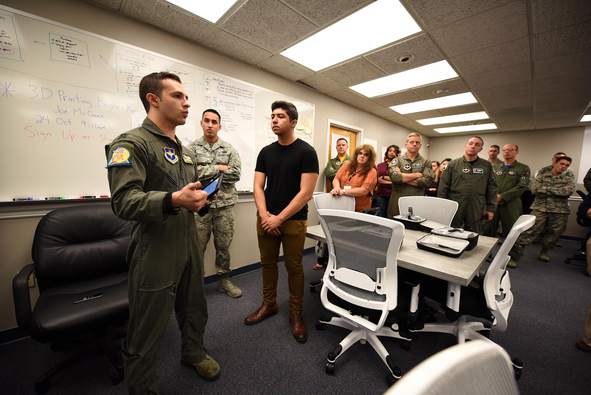Capt. Phillip Huebner, 37th Flying Training Squadron instructor pilot, speaks during the Spark Cell grand opening Oct. 19, 2018, on Columbus Air Force Base, Mississippi. The innovation team is requiring all individuals interested in 3D printing to get signed off by a Spark Cell member first to help protect the equipment. (U.S. Air Force photo by Airman 1st Class Keith Holcomb)