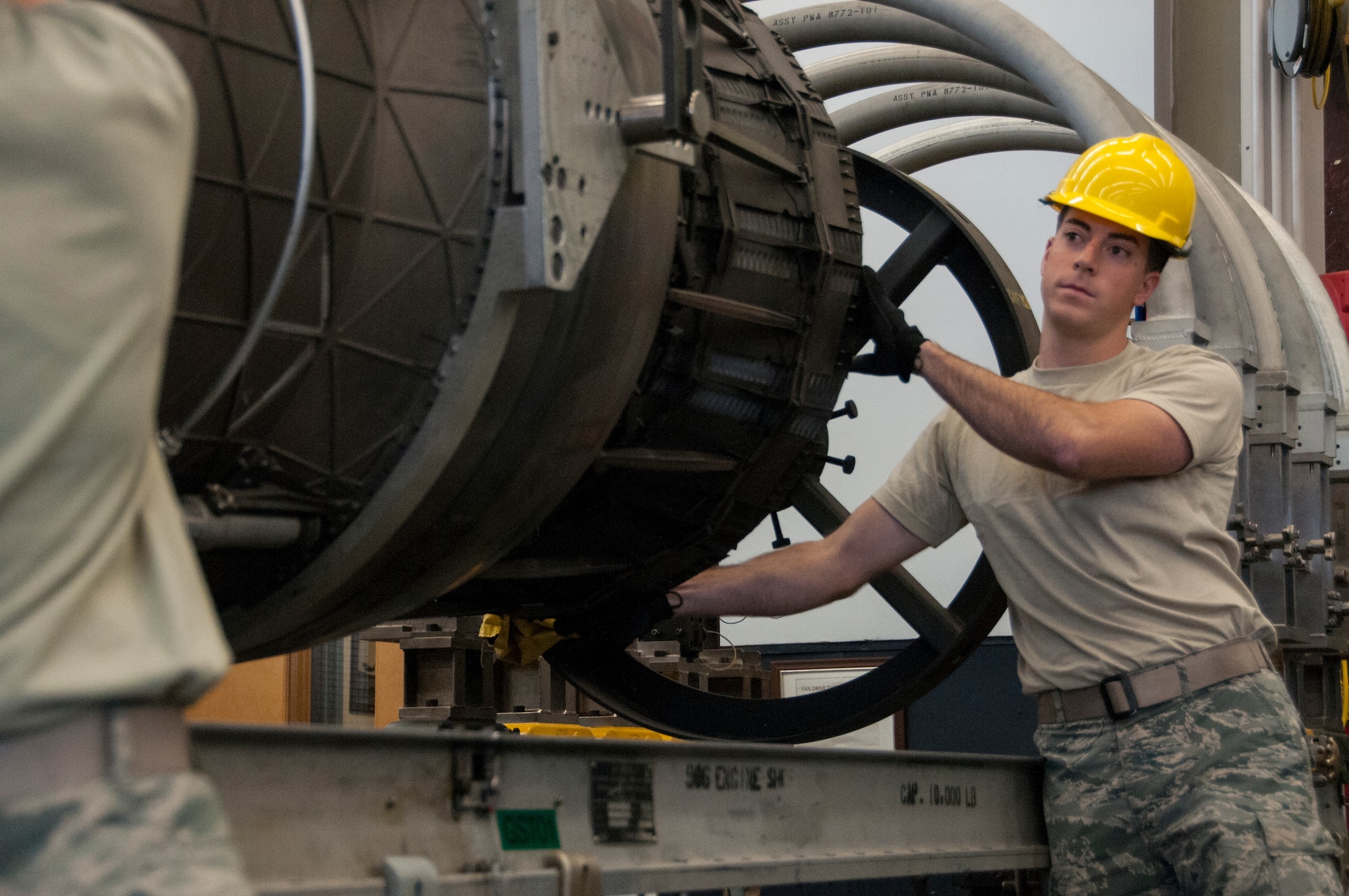 Senior Airman Andrew Feighery, 104th Maintenance Squadron aircraft engine mechanic, removes an augmenter module Oct. 17, 2018, at Barnes Air National Guard Base, Massachusetts. Feighery's recent deployment experience and mechanical engineering studies at The University of Massachusetts have further developed his skills as a mechanic. (U.S. Air National Guard Photo by Airman 1st Class Randy Burlingame)