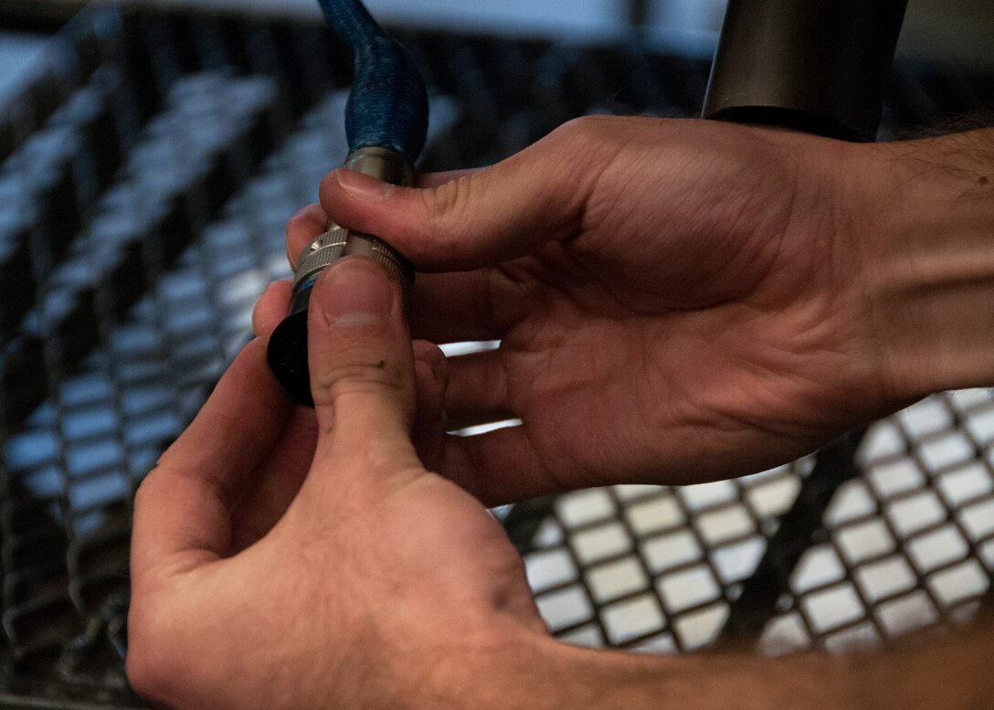 Senior Airman Andrew Feighery, 104th Maintenance Squadron aircraft engine mechanic, removes an augmenter module Oct. 17, 2018, at Barnes Air National Guard Base, Massachusetts. Feighery's recent deployment experience and mechanical engineering studies at The University of Massachusetts have further developed his skills as a mechanic. (U.S. Air National Guard Photo by Airman 1st Class Randy Burlingame)