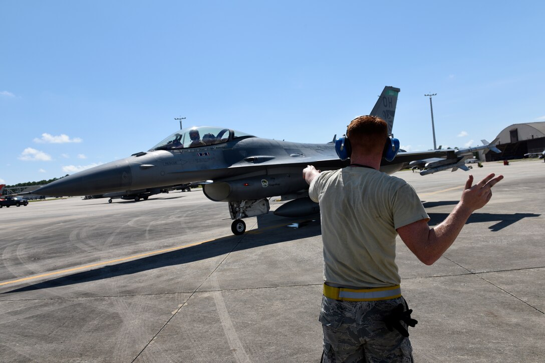 U.S. Air Force Senior Airman Jennifer Shippey, an electrical maintenance specialist, and Senior Airman Alex Hoffman, a crew chief, both assigned to the 180th Fighter Wing, Ohio Air National Guard, conduct preflight checks and inspections Sept. 17, 2018 during Combat Archer, a two-week air-to-air Weapons System Evaluation Program to prepare and evaluate operational fighter squadrons' readiness for combat operations, at Tyndall Air Force Base, Florida. Combat Archer equips 180FW Airmen with the skills they need to protect of the American homeland and provide increased capability to the Combatant Commander. (U.S. Air National Guard photo by Staff Sgt. Shane Hughes)