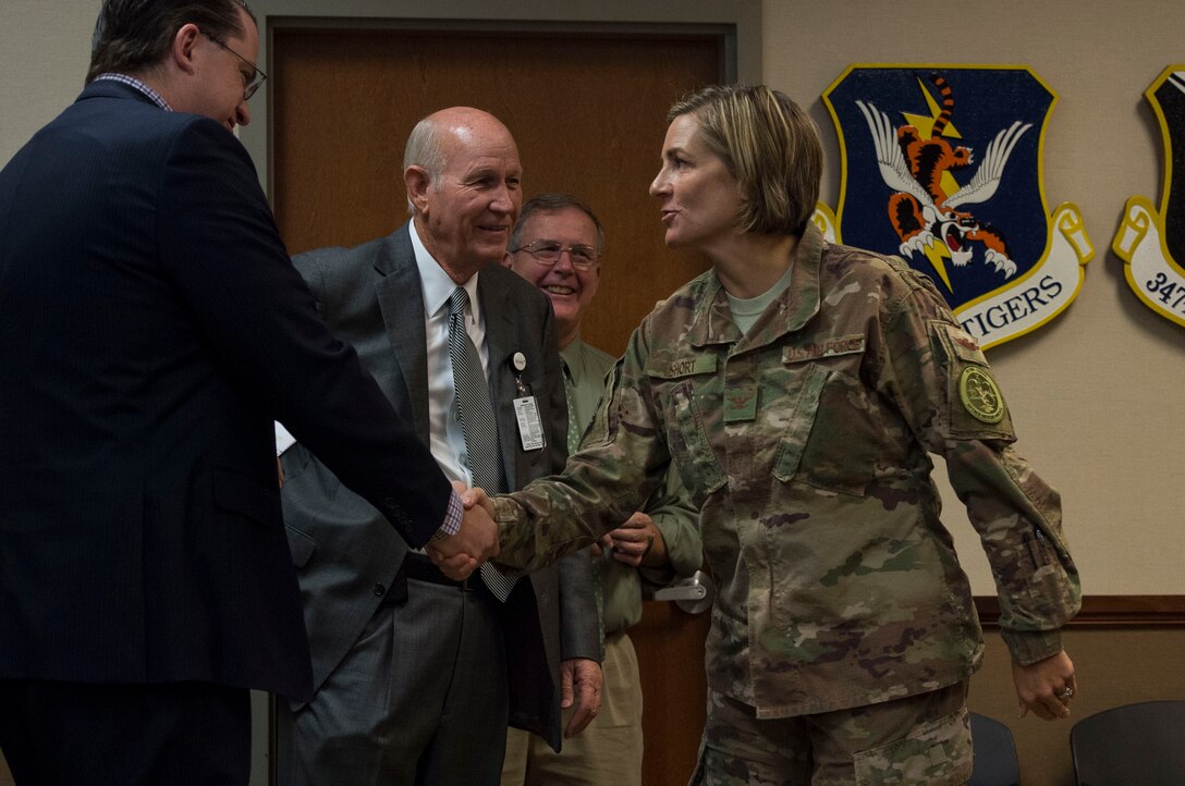 Col. Jennifer Short, 23d Wing commander, shakes hands with leadership from the South Georgia Medical Center during a Moody Community Partnership Committee meeting (MCPC), Oct. 24, 2018. The MCPC creates mutually beneficial partnerships to help Moody and Lowndes County save money, which is permitted through the Air Force public-public, public-private, or P4 initiative.  (U.S. Air Force photo by Senior Airman Janiqua P. Robinson)