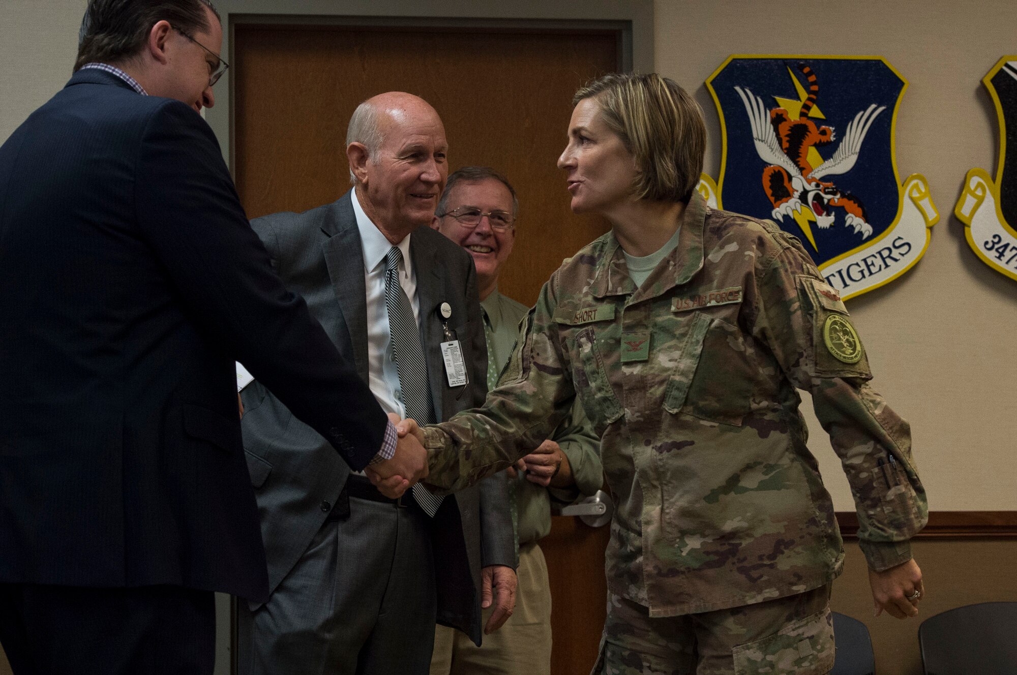 Col. Jennifer Short, 23d Wing commander, shakes hands with leadership from the South Georgia Medical Center during a Moody Community Partnership Committee meeting (MCPC), Oct. 24, 2018. The MCPC creates mutually beneficial partnerships to help Moody and Lowndes County save money, which is permitted through the Air Force public-public, public-private, or P4 initiative.  (U.S. Air Force photo by Senior Airman Janiqua P. Robinson)