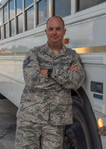 TSgt. Justin Hartley, 502d Logistics Readiness Squadron Vehicle Operations Support Supervisor, poses in front of one of the shuttles Joint Base San Antonio provides to it’s passengers on the installation Sept. 9, 2018. Hartley aided in the efforts developing the JBSA “Find My Ride” app to enhance JBSA’s shuttle passenger's experience. (U.S. Air Force photo by: Airman Shelby Pruitt)