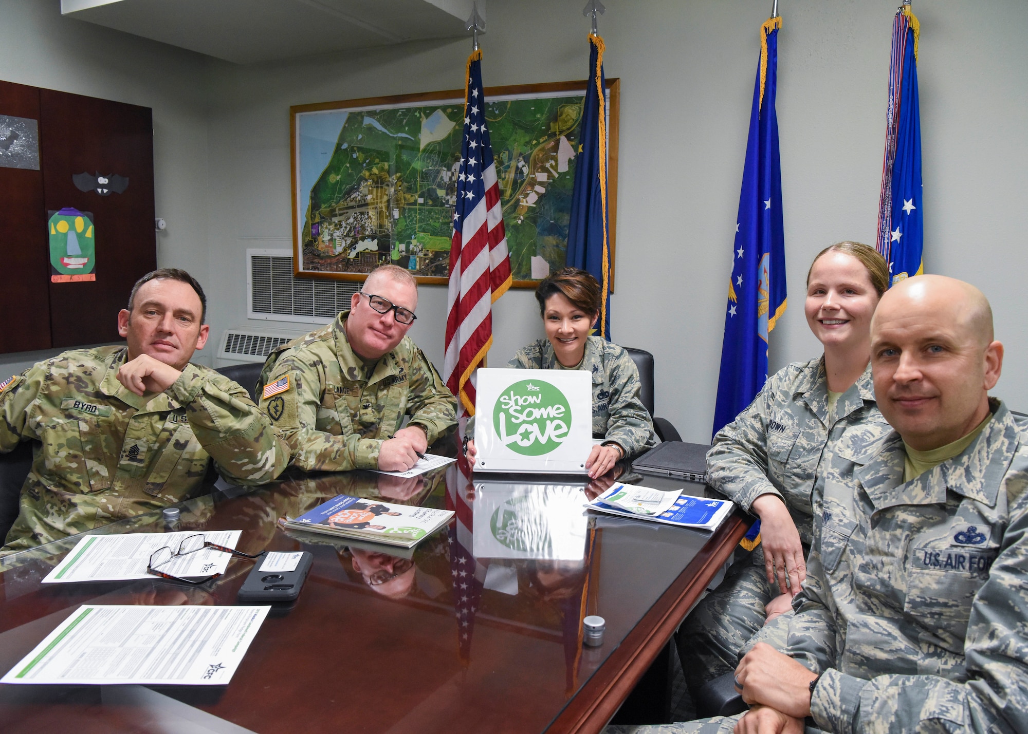Leadership from the 673d Air Base Wing meets with U.S. Air Force Tech. Sgt. Jessica Brown, a 673d ABW dedicated Combined Federal Campaign key worker, to discuss ways of donating to the 2018 CFC, “Show Some Love,” at Joint Base Elmendorf-Richardson, Alaska, Oct. 23, 2018. From the left, U.S. Army Sgt. Maj. Jerry Byrd, 673d ABW garrison sergeant major; U.S. Army Col. Adam Lange, JBER deputy commander; U.S. Air Force Col. Patricia Csànk, 673d ABW and JBER commander; Brown; and U.S. Air Force Chief Master Sgt. Charles Orf, 673d ABW command chief.