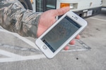 TSgt. Justin Hartley, 502d Logistics Readiness Squadron Vehicle Operations Support supervisor, showcases a preview of the Joint Base San Antonio “Find My Ride” app Sept. 9, 2018 on JBSA-Lackland. This app was created to enhance JBSA shuttle passenger’s experience by keeping them informed on the bus routes and delays. (U.S. Air Force photo by: Airman Shelby Pruitt)