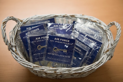 Key-shaped pins, awarded to Key Spouses following initial training, sit in a basket at Joint Base Elmendorf-Richardson, Alaska, Oct. 16, 2018. Key Spouses are selected by unit commanders to provide support for their squadron's families.