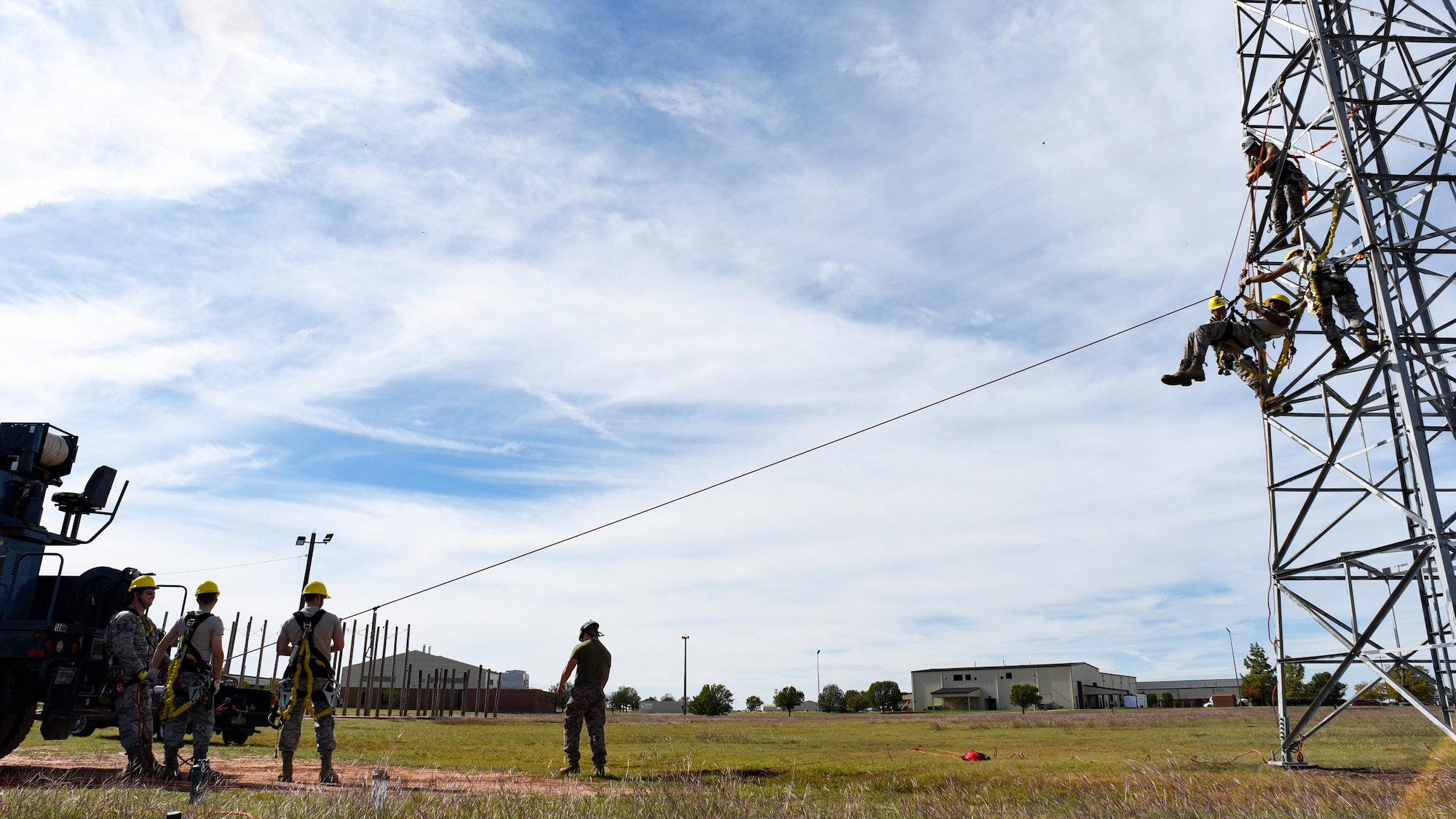 364th Training Squadron cable and antenna systems apprentice course students climb a communications tower to perform a ground based tower rescue