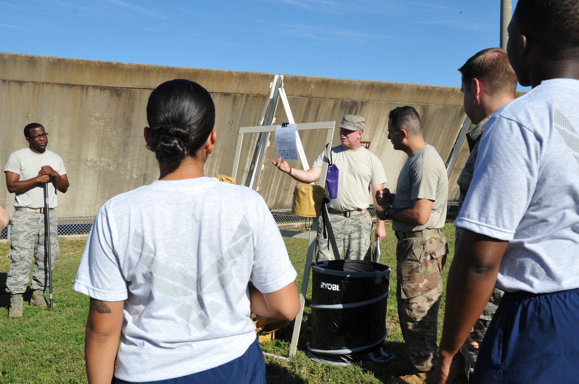 Staff Sgt. Ronald Patton, 403rd Operation Support Squadron aircraft flight equipment craftsman explains the direction card during a refresher training for members of the U.S. Air Force Reserve 403rd Wing on decontamination procedures of aircrew members at Keesler Air Force Base, Mississippi, during the October unit training assembly.  The AFE, formerly known as life support, are responsible for the safety of the aircrew members, including the decontamination line in the event of a biological, radiological, or chemical attack.  (U.S. Air Force photo by Master Sgt. Jessica Kendziorek)