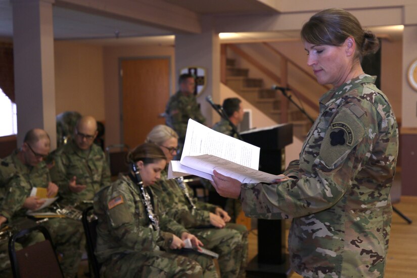 88th Readiness Division Blue Devils Music Unit, Chief Warrant Officer Three Sharon Toulouse, 312th Army Band Executive Officer, examines sheet music before leading the 88th Readiness Division Blue Devils Music Unit during the U.S. Army Reserve Music Sergeant Major change of responsibility ceremony at Fort McCoy, Wisconsin, October 20, 2018.