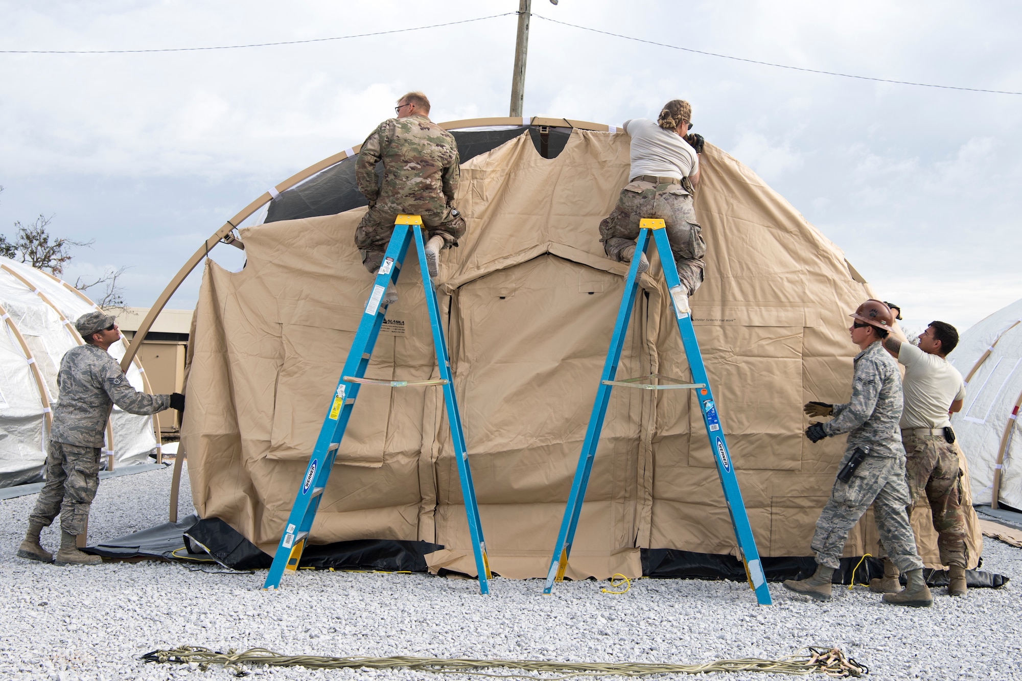 U.S. Air Force Airmen building tents
