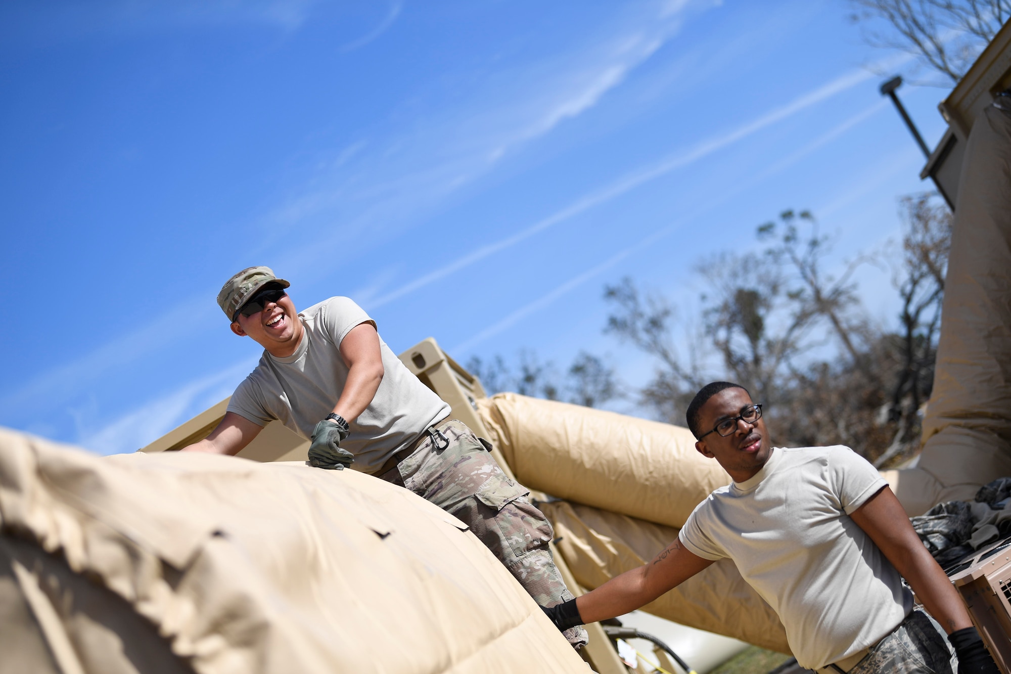 U.S. Air Force Airmen building tents