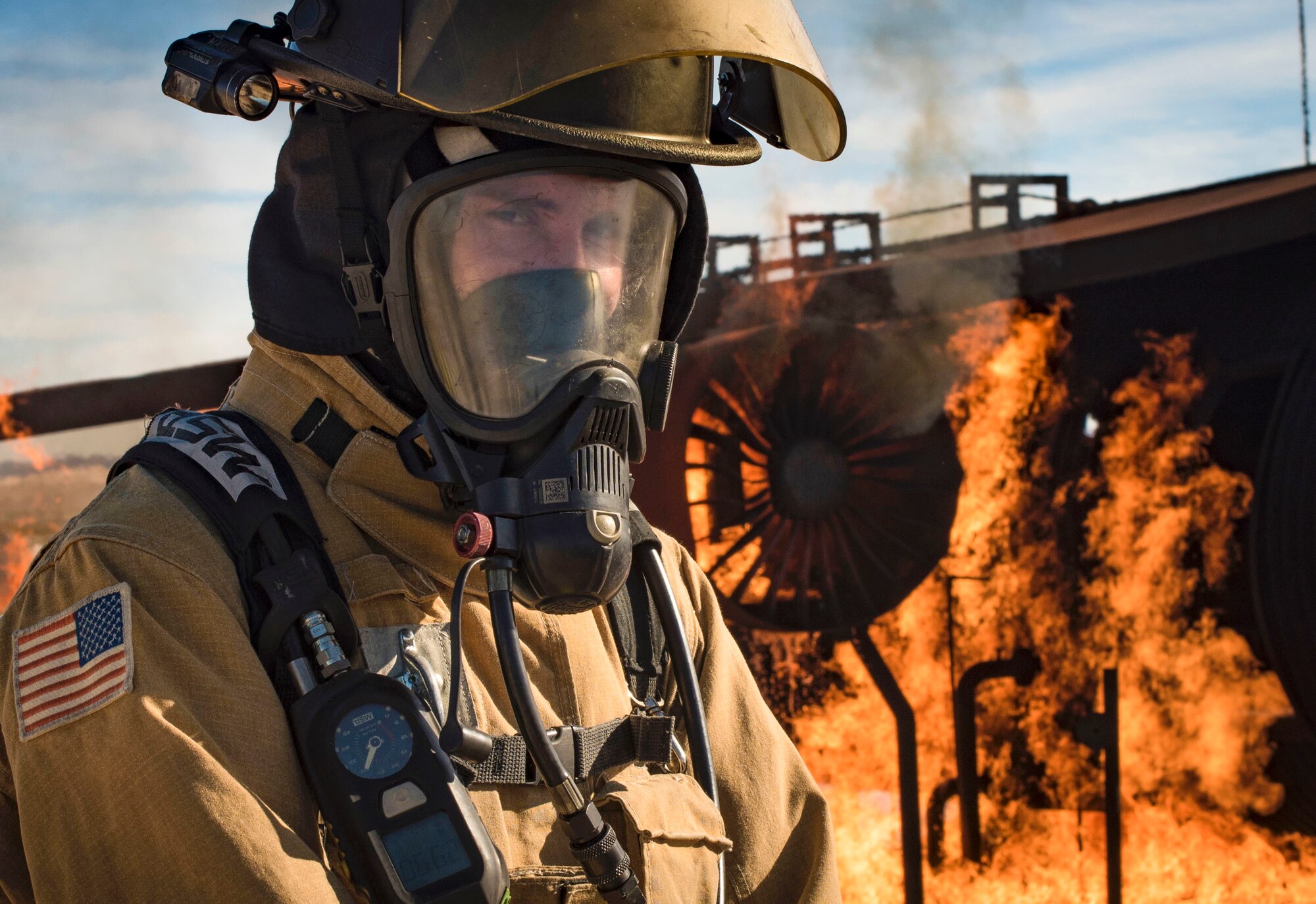 Staff Sgt. Brice Haylett, 99th Civil Engineer Squadron firefighter, catches his breath before instructing his team on proper firefighting procedures during a training exercise Oct. 23, 2018, at Nellis Air Force Base, Nev. More than a dozen firefighters from Nellis, Creech and Clark County Fire Departments participated in the exercise. (U.S. Air Force photo by Airman 1st Class Andrew D. Sarver)