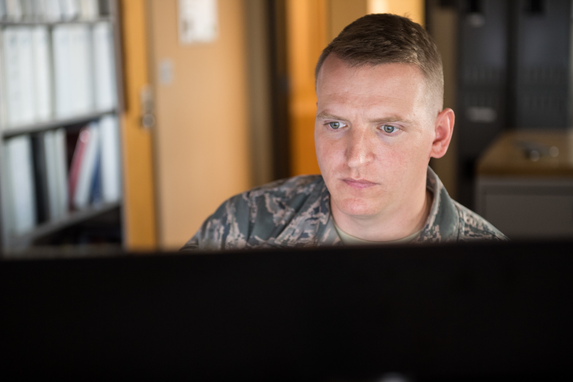 Senior Airman Kyle Prestwood, 2nd Operations Support Squadron weather forecaster, verifies observations at Barksdale Air Force Base La., Oct. 10, 2018. The weather flight has a sensor on the airfield that can detect the location of lightning strikes. (U.S. Air Force photo by Airman 1st Class Lillian Miller)