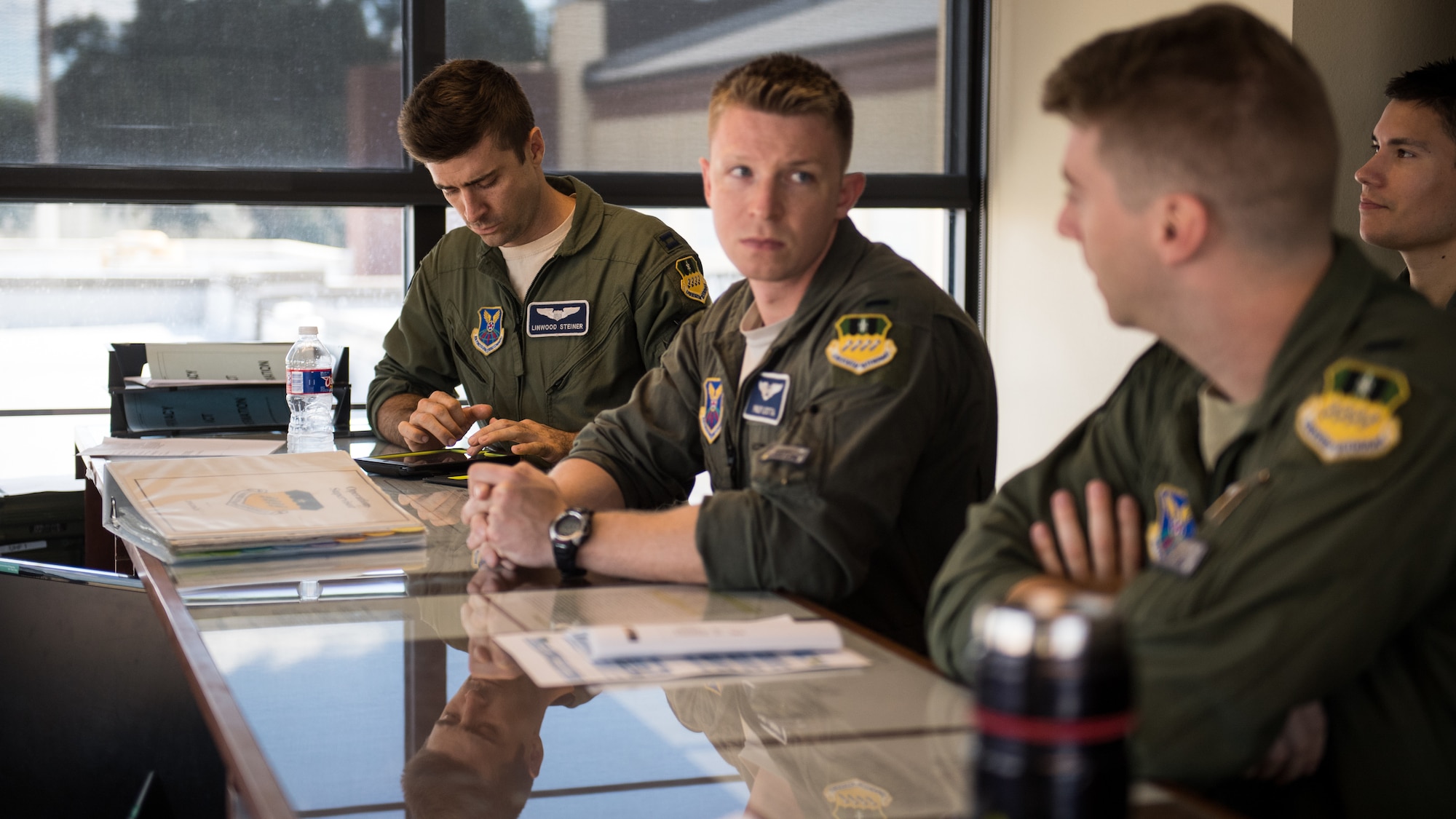 Barksdale aircrew prepare for a weather brief at Barksdale Air Force Base La., Oct. 10, 2018. The 2nd Operations Support Squadron weather flight briefed approximately 1,200 crews throughout 2017 on the forecast and the impact it would have on their flight. (U.S. Air Force photo by Airman 1st Class Lillian Miller)