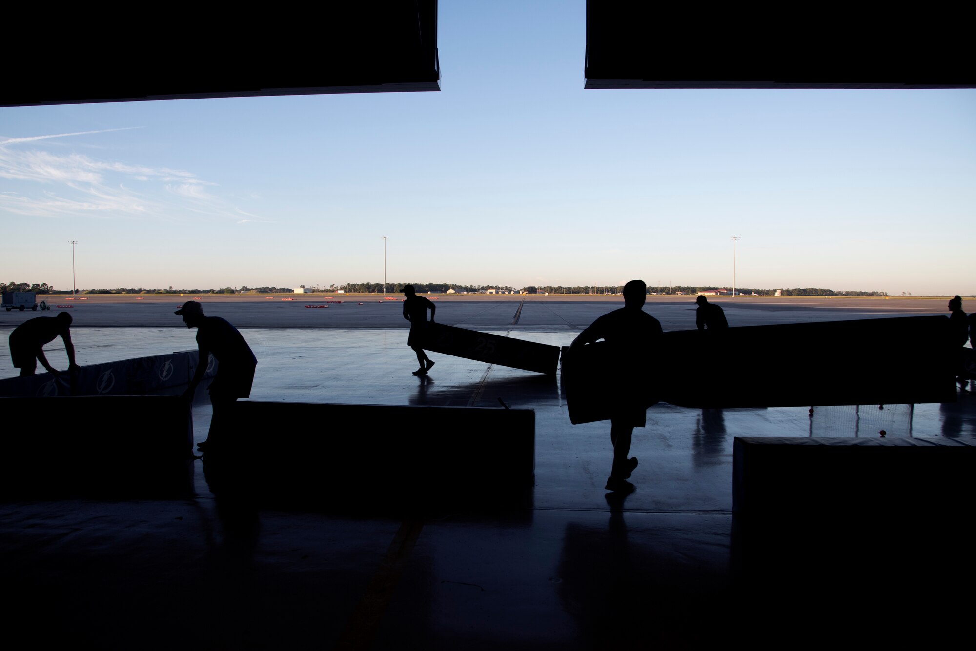 Tampa Bay Lightning’s Street Team and USAA volunteers set up a street hockey rink at Hangar 4 on MacDill Air Force Base, Florida, Oct. 25, 2018.