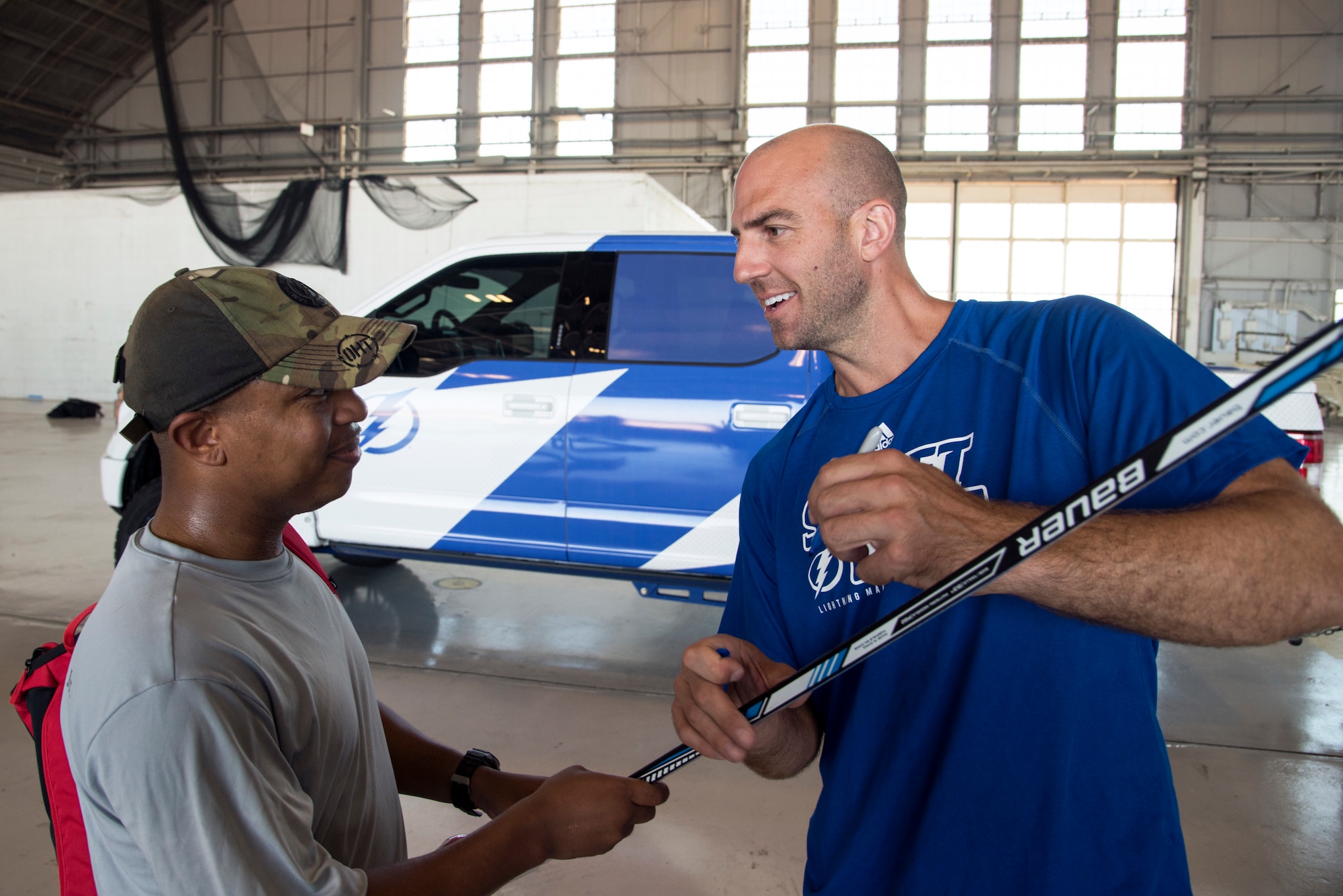 Former Tampa Bay Lightning player, Mathieu Garon, signs an Airman’s hockey stick at MacDill Air Force Base, Florida, Oct. 25, 2018.