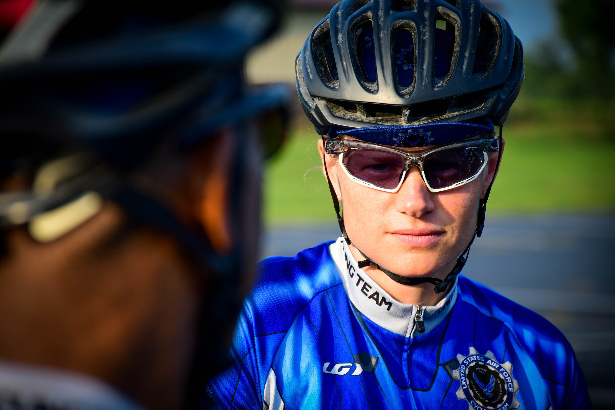 Capt. Sara McDowell, 375th Medical Operations Squadron mental health clinic officer in charge, talks with Lt. Col. (ret.) Thomas Black, before a bike ride through O’Fallon, Ill., July 12, 2018. McDowell is the team captain of the Scott Air Force Base, Ill. Chapter of the Air Force Cycling Team. She is in charge of coordinating practices as well as leading the team through the Register’s Annual Great Bike Ride Across Iowa. (U.S. Air Force photo by Staff Sgt. Michael Cossaboom)